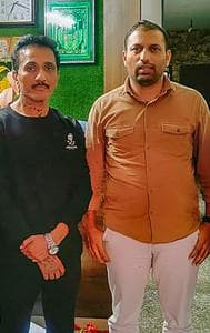 Mumbai Police Crime Branch personnel with Bhavish Bhinde (in black) after arresting him in connection the billboard collapse.
