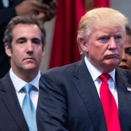 FILE- Donald Trump, right, and attorney Michael Cohen, left, during a visit to the Pastors Leadership Conference at New Spirit Revival Center, Sept. 21, 2016, in Cleveland.  