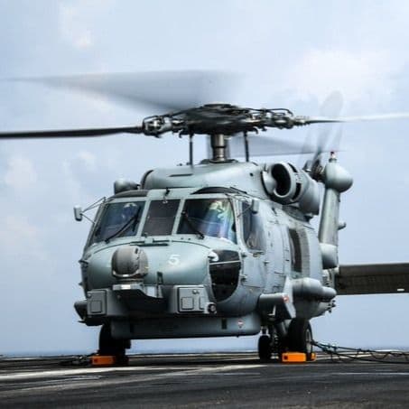 An Indian Navy MH-60R Seahawk helicopter on INS Vikrant's deck.
