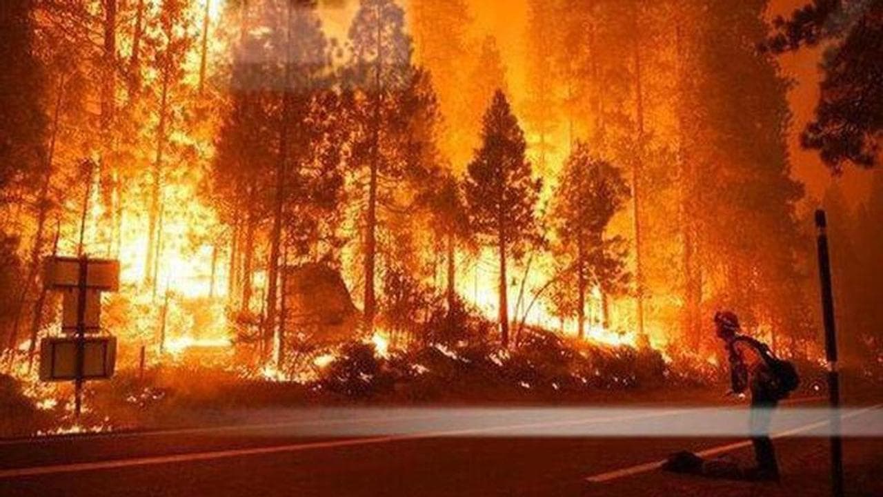 California: Thousands battle power cuts as storm exacerbates wildfires