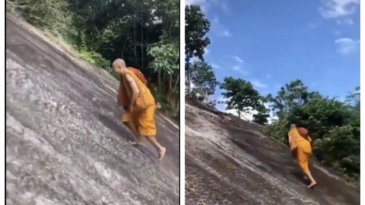 Monk Climbs Hill Without Ropes
