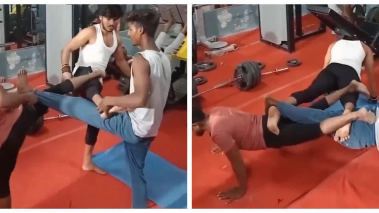Men performs a new form of push ups in gym