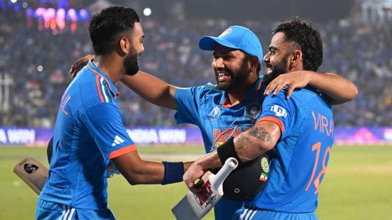Virat Kohli, Rohit Sharma & KL Rahul celebrate after winning the ODI World Cup match against Bangladesh