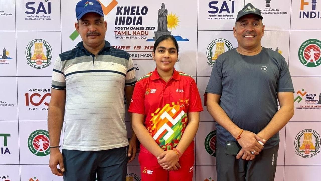 Suruchi Phogat flanked by her father Inder (left) and coach Suresh Singh after winning the gold medal at Guru Nanak College in Chennai