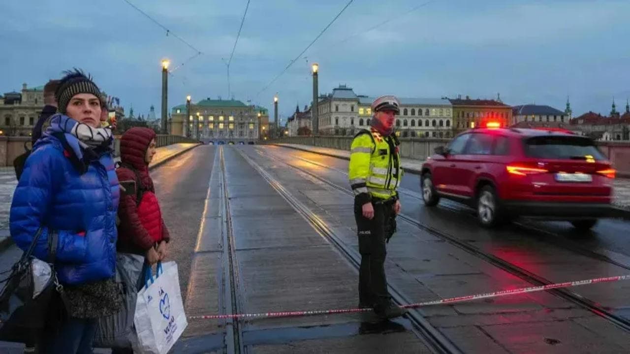 A police officer guards a street after a shooting in downtown Prague, Czech Republic