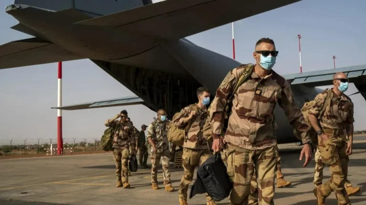 French soldiers disembark from a U.S. Air Force C130 cargo plane at Niamey, Niger base