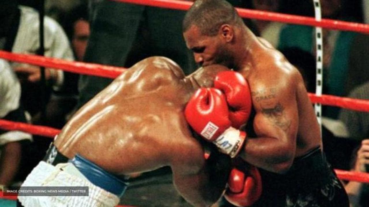 why did mike tyson bite evander holyfield