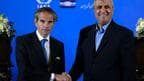 IAEA Director General Rafael Grossi (left) shaking hands with head of Iran's atomic energy department Mohammad Eslami during a joint press conference. 
