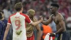 Bayern Munich's Harry Kane and Real Madrid's Aurelien Tchouameni post first leg of UCL semis