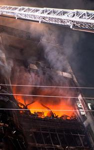 Firefighters work to contain a fire that broke out at a commercial complex in Dhaka, Bangladesh