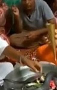 Terrifying Video Of Family Fearlessly Performing Puja With Live Black Cobra 