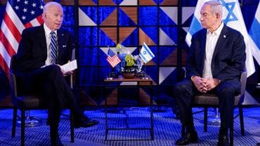 President Joe Biden, left, speaks with Israeli Prime Minister Benjamin Netanyahu on October 18, in Tel Aviv, Israel