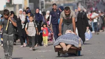 Caravan of Palestinian evacuees walk south within Gaza